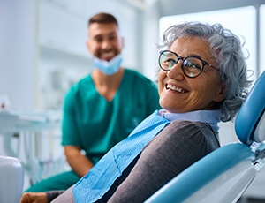 Woman smiling after learning how dentures are made in Carrollton