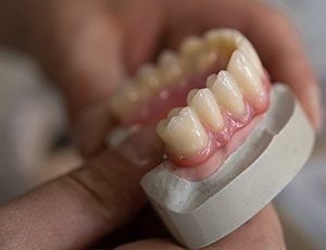 Lab technician creating a set of dentures