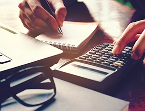 Woman using a calculator