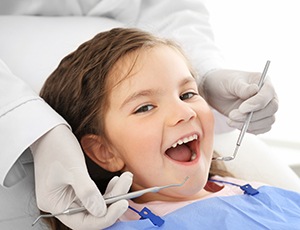 Little girl smiling while seeing a Medicaid & CHIP dentist in Carrollton