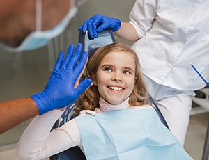 Girl smiling in the treatment chair